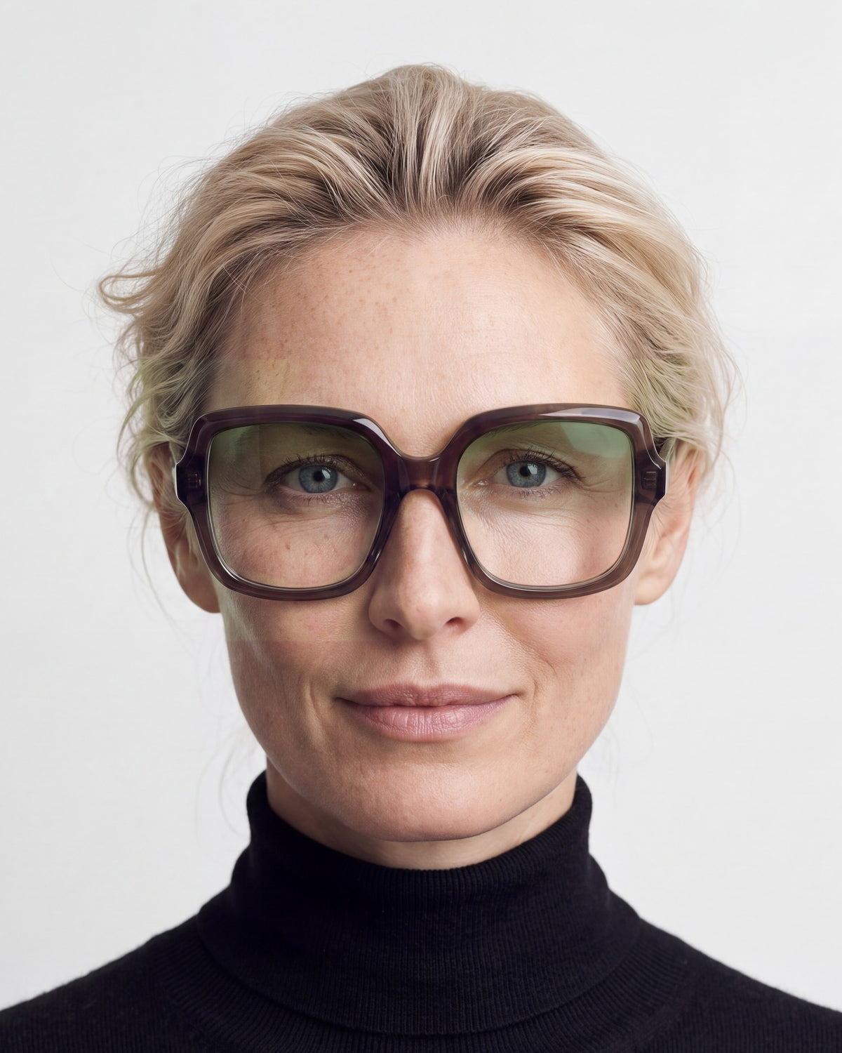 Elara in dark brown, worn, Sage lenses